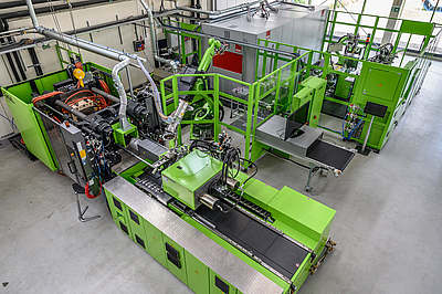 Automatisierte Spritzgieß-Produktionszelle für die Fertigung von endllosfaserverstärkter Leichtbauteile